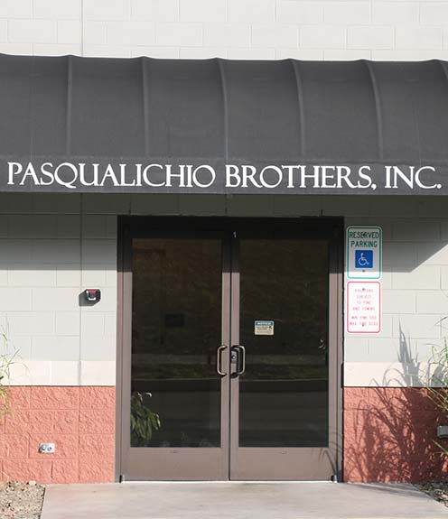 Pasqualichio Brothers Building Exterior with trucks